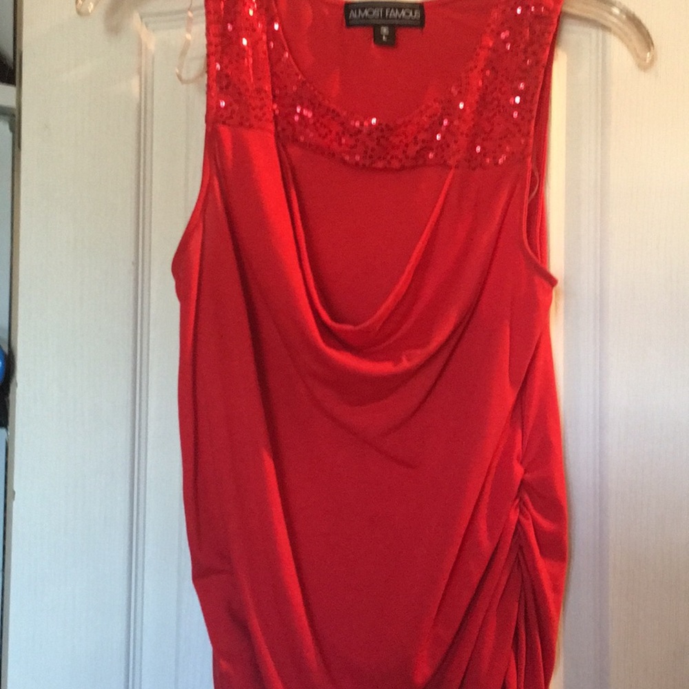 Red sleeveless blouse